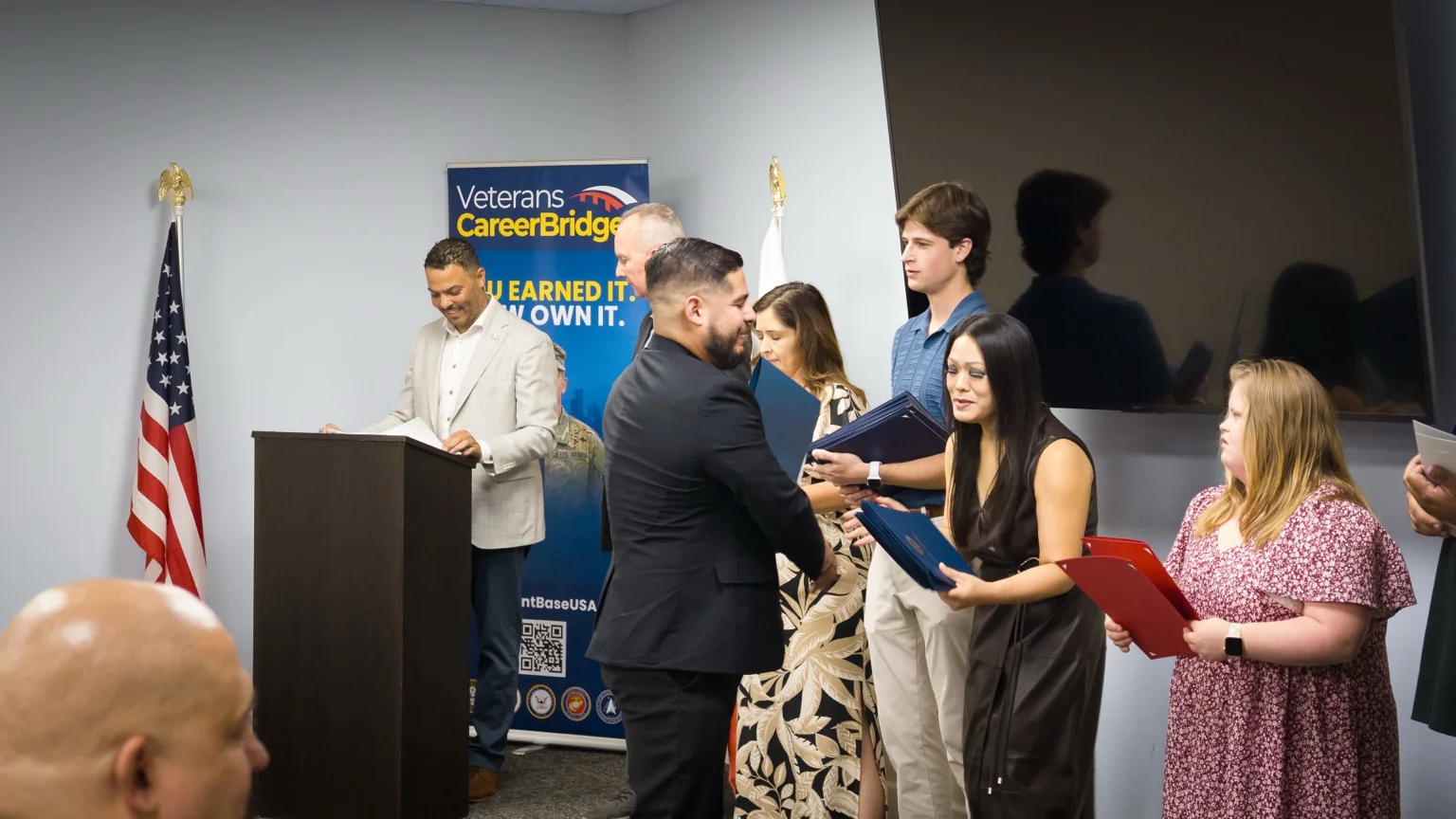 Veterans CareerBridge graduates receiving certificates at a recognition ceremony